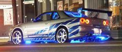 cars-nissan skyline r34 with heaps of neon lights real nice.