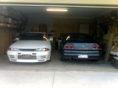 bros car and my old one in the garage.