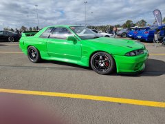 Green R32 GTR in drag spec with wider panels looks tough