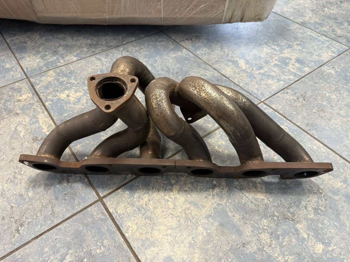 Trying to identify an old-school GReddy RB26 twin turbo exhaust manifold (Top+Bottom mount and single wastegate)